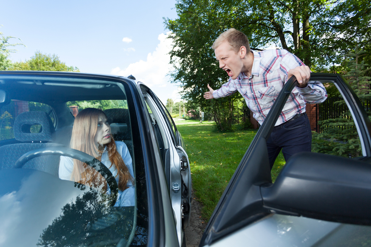 Mad man screaming at female driver